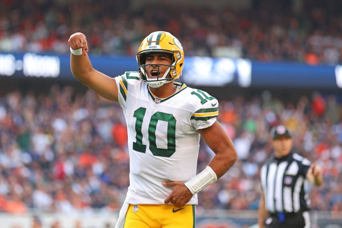 CHICAGO, ILLINOIS - SEPTEMBER 10:  Jordan Love #10 of the Green Bay Packers celebrates a touchdown pass to Romeo Doubs (not pictured) against the Chicago Bears during the second half at Soldier Field on September 10, 2023 in Chicago, Illinois. (Photo by Michael Reaves/Getty Images)