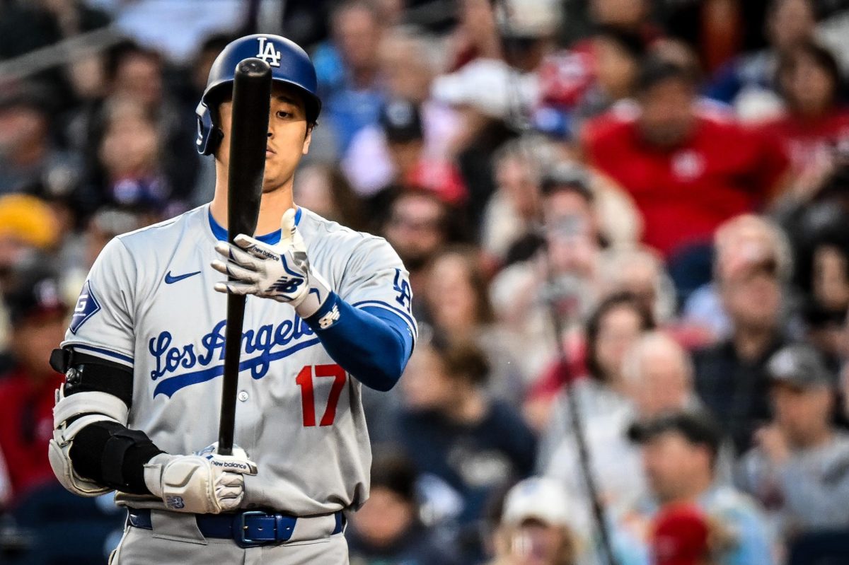 Ohtani examines his bat against the Washington Nationals at Nationals Park.