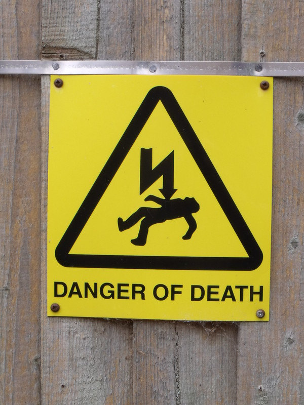 "Holkham Hall - Coach House / Stable Block - Yellow warning sign - Danger of Death" by ell brown 
